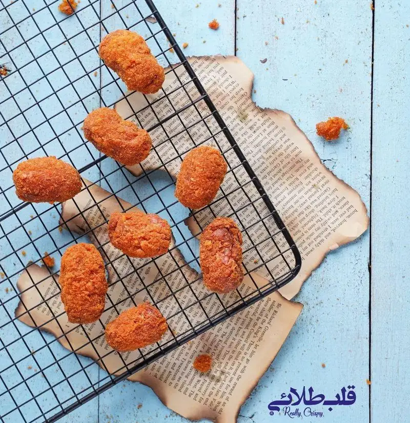 تصویر ناگت‌های سوخاری و بسیار کریسپی قلب طلایی نیاوران، ایده‌آل برای سفارش فست فود خوشمزه و ترد در تهران.