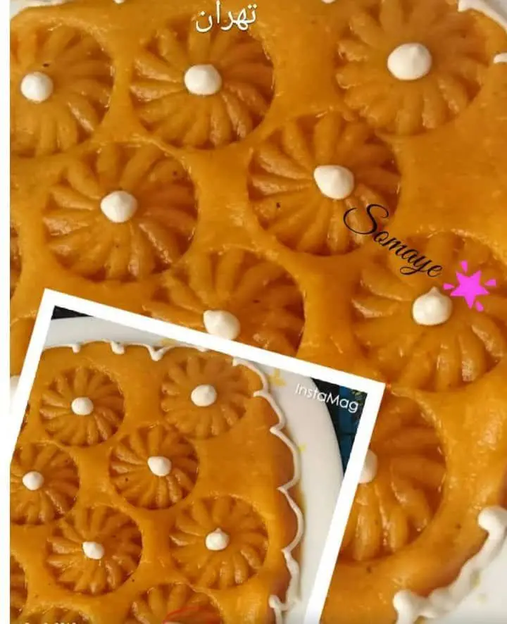 حلوای مجلسی زعفرانی سنتی با تزیینات گل و خامه، اثری هنری از هنرکده کارامل در تهران، مناسب سفارشات مراسم و مجالس.