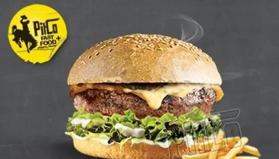 تصویر یک همبرگر لذیذ و داغ از فست فود پیتکو با نان کنجدی، گوشت آبدار، پنیر ذوب شده و کاهو تازه، بهترین غذای آماده.