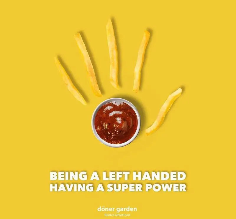 سیب زمینی سرخ کرده و سس قرمز به شکل دست چپ روی پس زمینه زرد در تبلیغ خلاقانه فست فود دونر گاردن پاسداران.