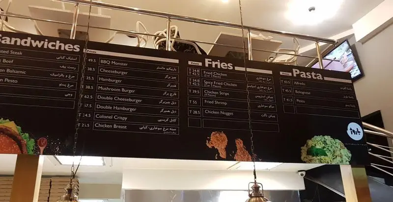 تصویر منوی دیجیتال رستوران باروژ: لیست کامل ساندویچ، برگر، سیب‌زمینی سرخ‌کرده، مرغ سوخاری و پاستا با قیمت‌ها.