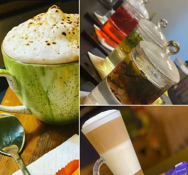 تصویری جذاب از انواع نوشیدنی‌های دلنشین کافه برلین شامل کاپوچینو با فوم فراوان، لاته ماکیاتو سه رنگ و دمنوش‌های متنوع در محیطی دنج و دوستانه.