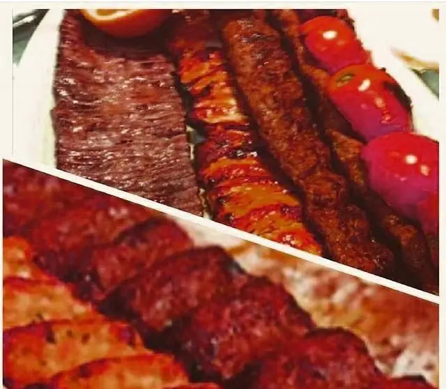 سفره‌ای رنگین از کباب‌های لذیذ و تازه شامل کباب کوبیده، برگ و جوجه کباب، غذای محبوب ایرانی از کباب سرای آیدا.