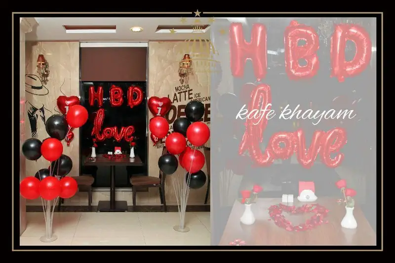 فضایی جذاب و رمانتیک در کافه خیام، مناسب جشن های تولد، سالگرد و ولنتاین با بادکنک آرایی شیک قرمز مشکی.