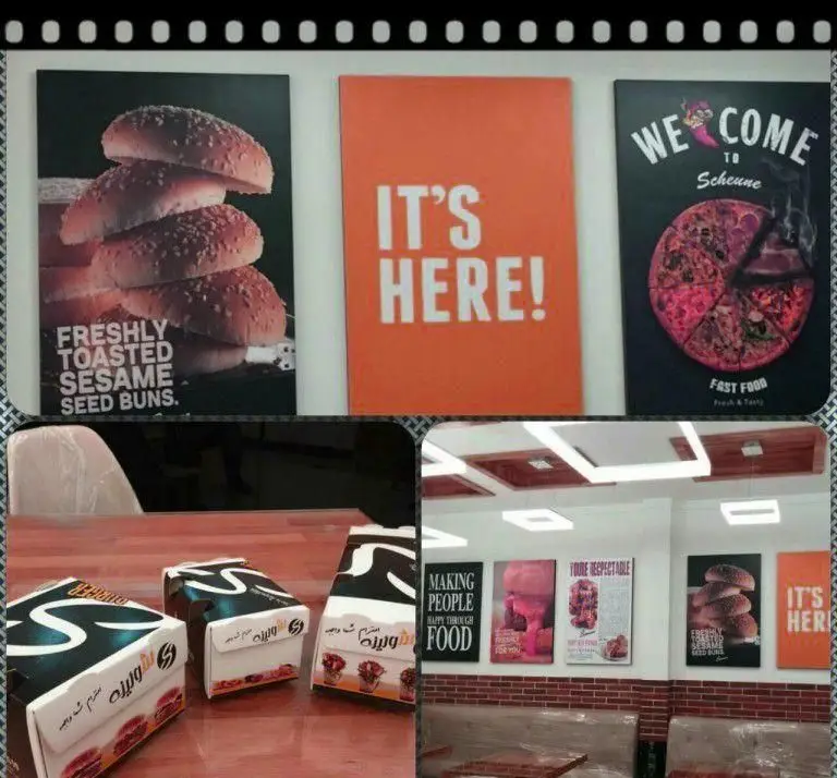 فضای داخلی فست فود شورینه با پوسترهای تبلیغاتی همبرگر و پیتزا، و جعبه های برند شورینه. تجربه غذای تازه و خوشمزه.