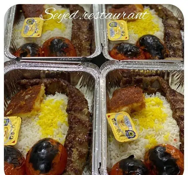 چلوکباب کوبیده ممتاز رستوران سید شهر ری با برنج ایرانی، ته دیگ طلایی، گوجه کبابی، زعفران و کره، غذای سنتی بیرون بر.