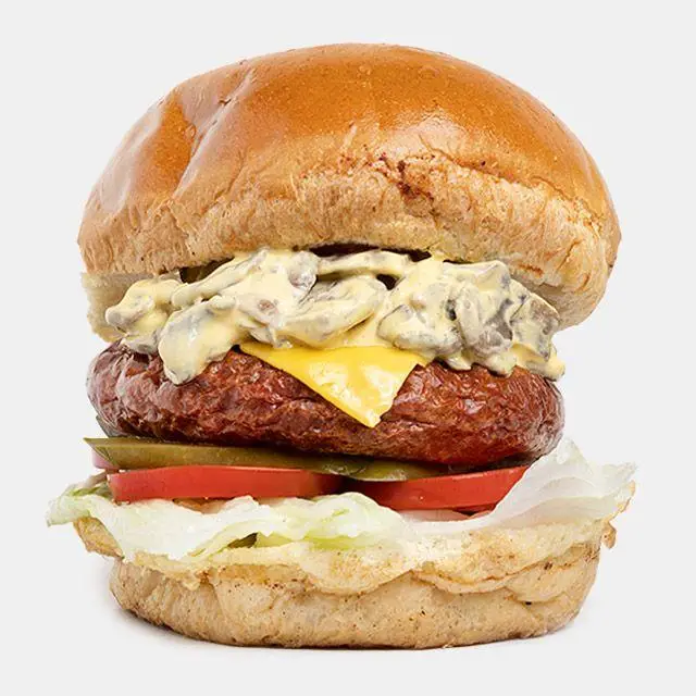 همبرگر ویژه قارچ و پنیر باروس برگر، با پتی گوشت، سس قارچ خامه‌ای، پنیر چدار، کاهو، گوجه و خیارشور روی نان گرد.