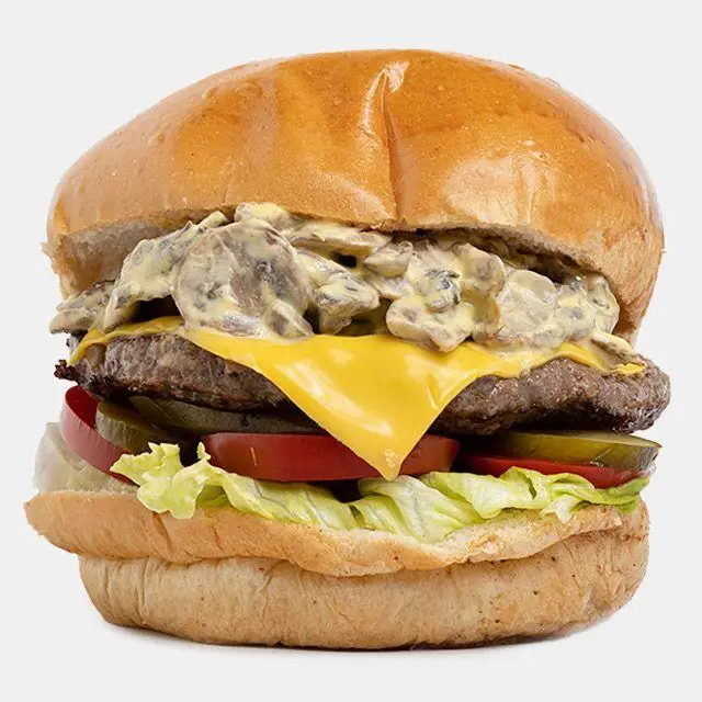 همبرگر قارچ و پنیر باروس برگر: پتی گوشت، پنیر چدار آب شده، سس قارچ خامه‌ای، کاهو، گوجه و خیارشور در نان تازه. تجربه‌ای لذیذ از باروس.