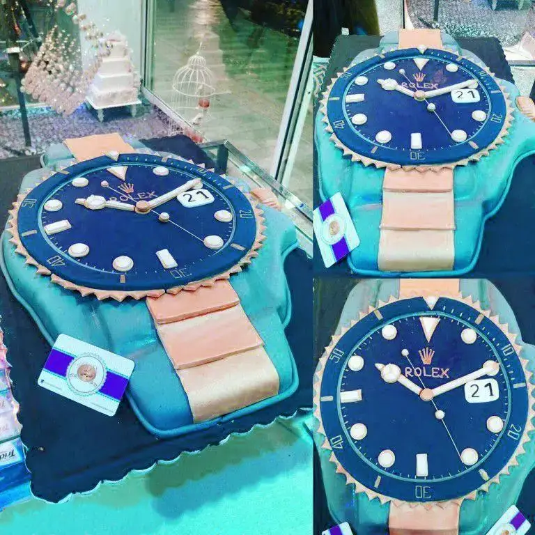 کیک تولد لوکس طرح ساعت رولکس آبی و بند مسی، سفارشی شیرینی لادن طلایی، مناسب جشن‌ها و مراسم خاص.