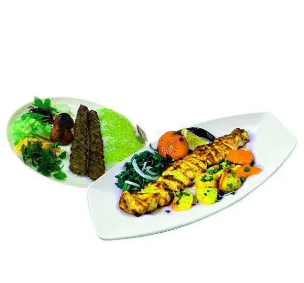 عکس خوشمزه از انواع کباب ایرانی شامل جوجه کباب و کباب کوبیده با برنج سبز و دورچین کامل از رستوران فرنگی ارکیده طلایی